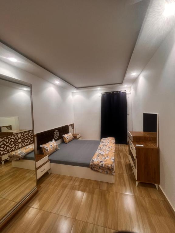 En eller flere senge i et værelse på DAKAR CONFORT