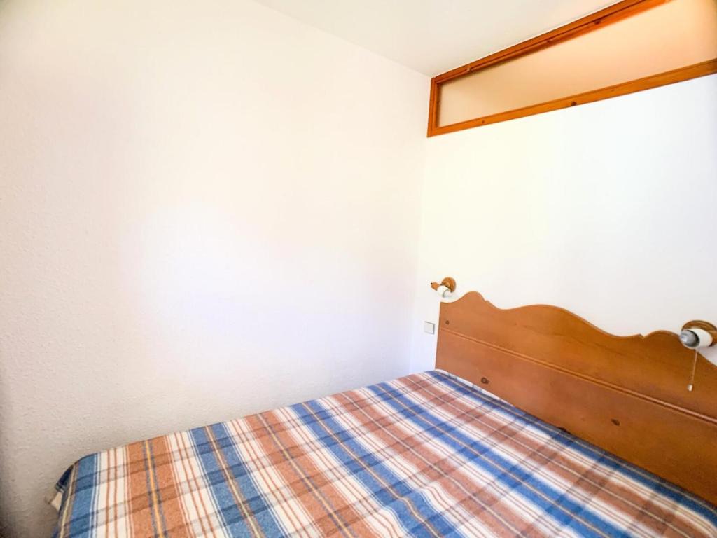 Łóżko lub łóżka w pokoju w obiekcie Résidence Hameau Du Borsat 3 - Appartement lumineux · Accès direct aux pistes MAE-2684