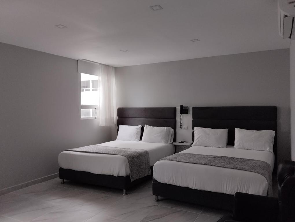 Postel nebo postele na pokoji v ubytování Hotel OR Suite