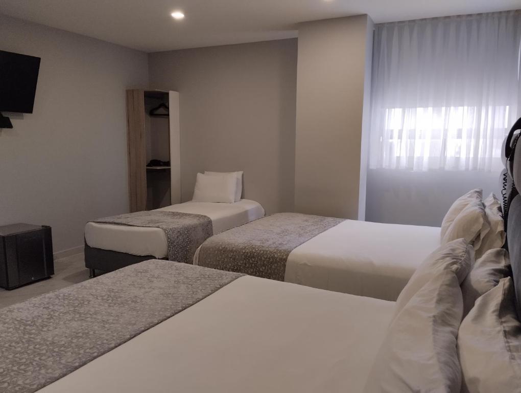 Postel nebo postele na pokoji v ubytování Hotel OR Suite
