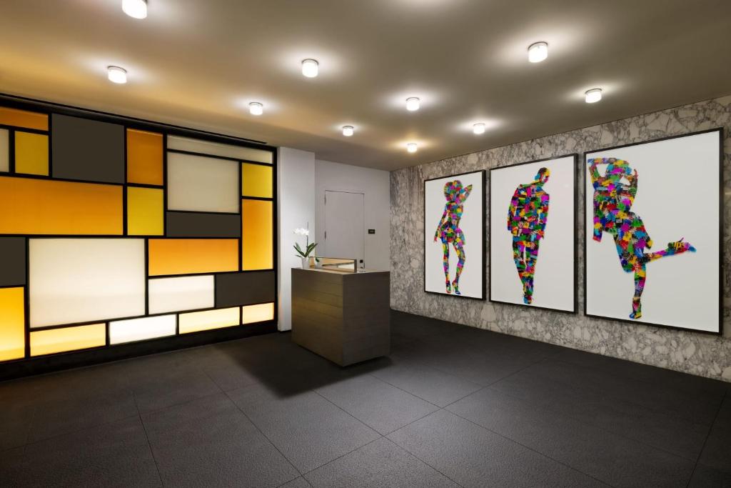 a lobby with colorful art on the walls at Residence Inn by Marriott New York Downtown Manhattan/World Trade Center Area in New York