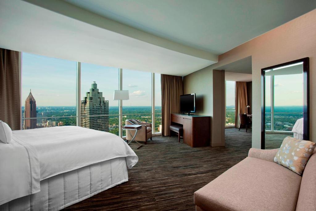 a hotel room with a bed and a large window at The Westin Peachtree Plaza, Atlanta in Atlanta