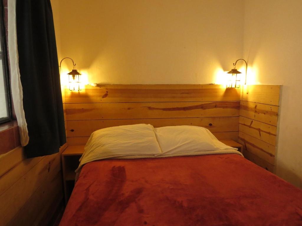 Postel nebo postele na pokoji v ubytování La Catrina Hostel
