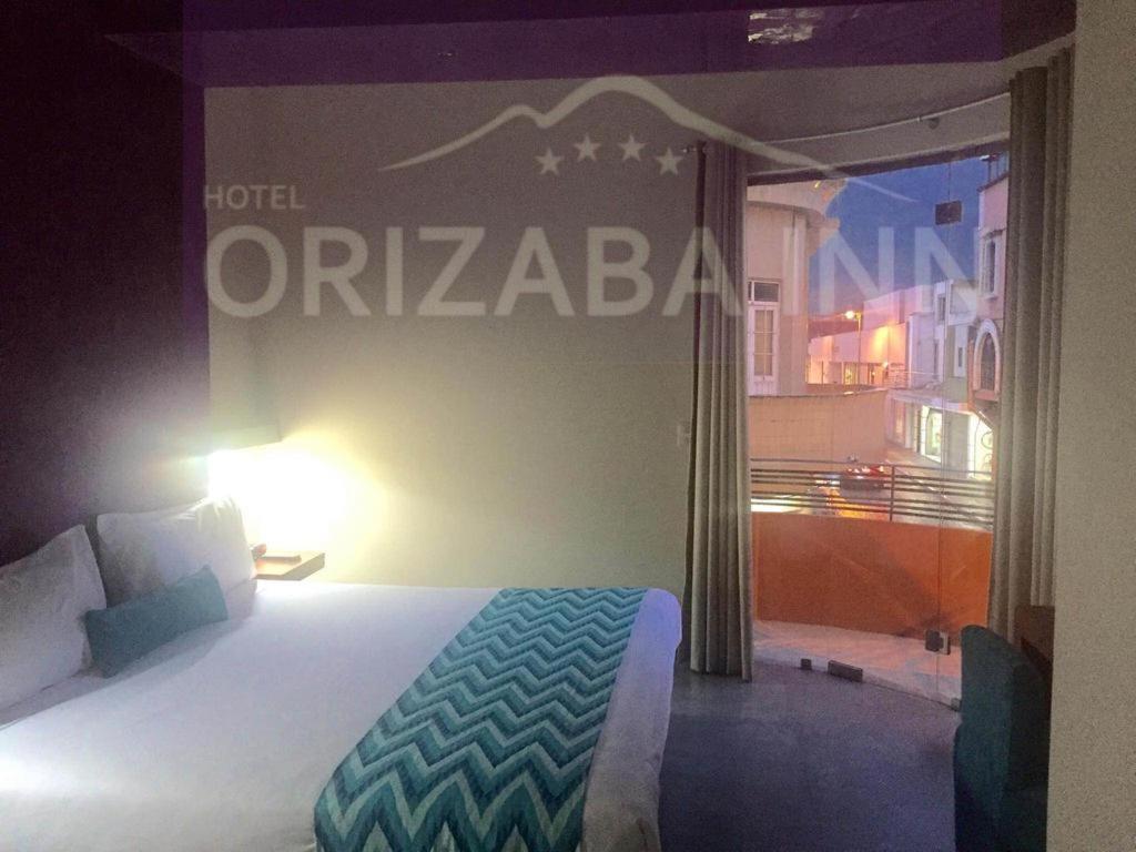 Postel nebo postele na pokoji v ubytování Orizaba Inn