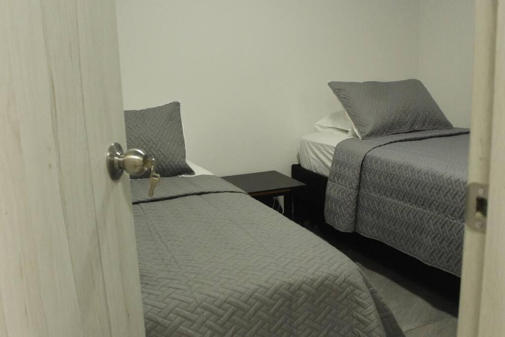 Postel nebo postele na pokoji v ubytování Casa Hotel Anturio