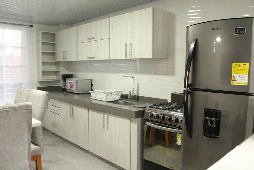 Kuchyň nebo kuchyňský kout v ubytování Casa Hotel Anturio