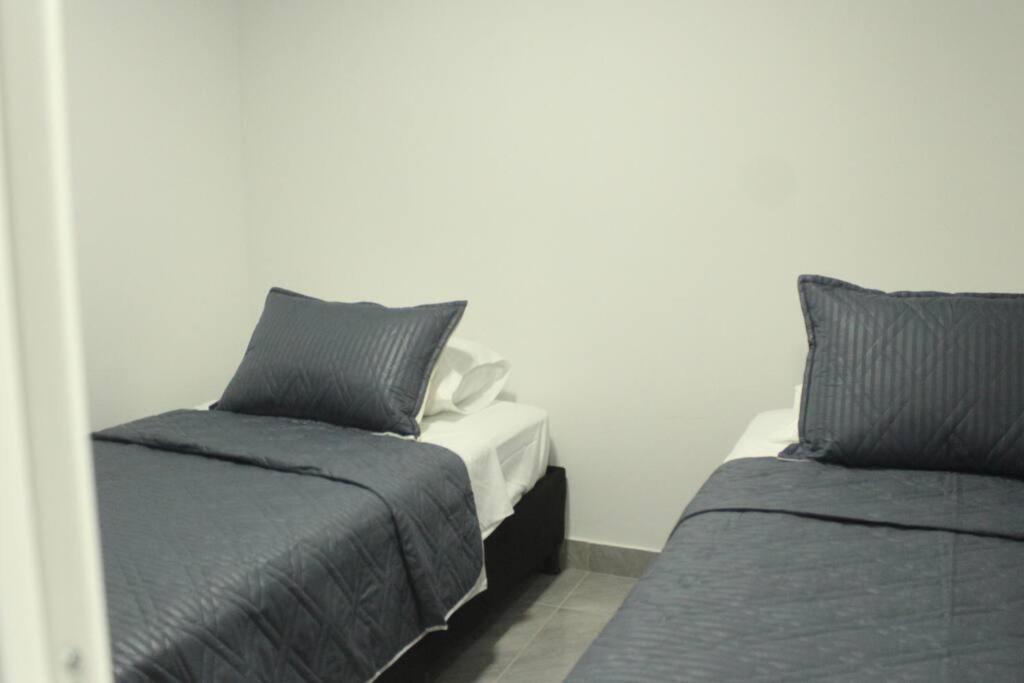 Postel nebo postele na pokoji v ubytování Casa Hotel Anturio