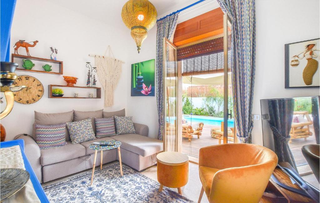 Telewizja i/lub zestaw kina domowego w obiekcie Lovely Home In Marina Di Modica