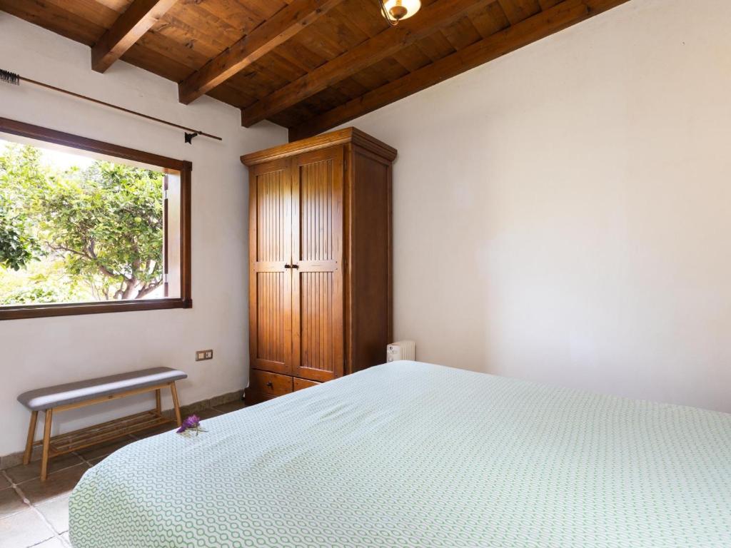 Posteľ alebo postele v izbe v ubytovaní Casa rural con piscina climatizada y jardín en Icod de los Vinos - ES-279-18