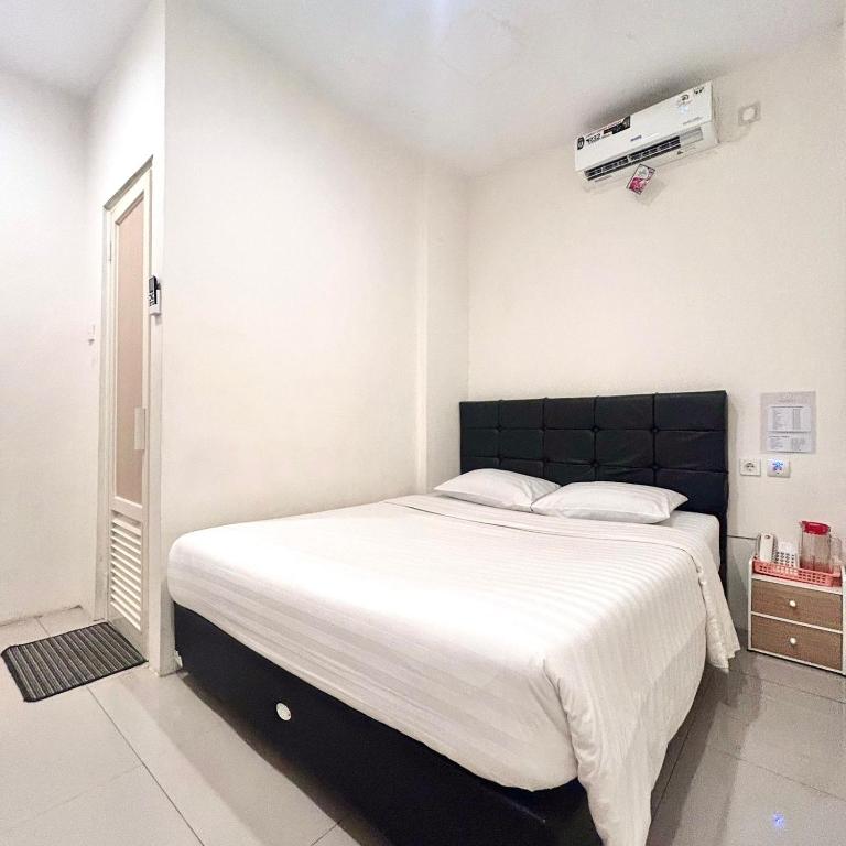 Letto o letti in una camera di Priority Guest House Samarinda