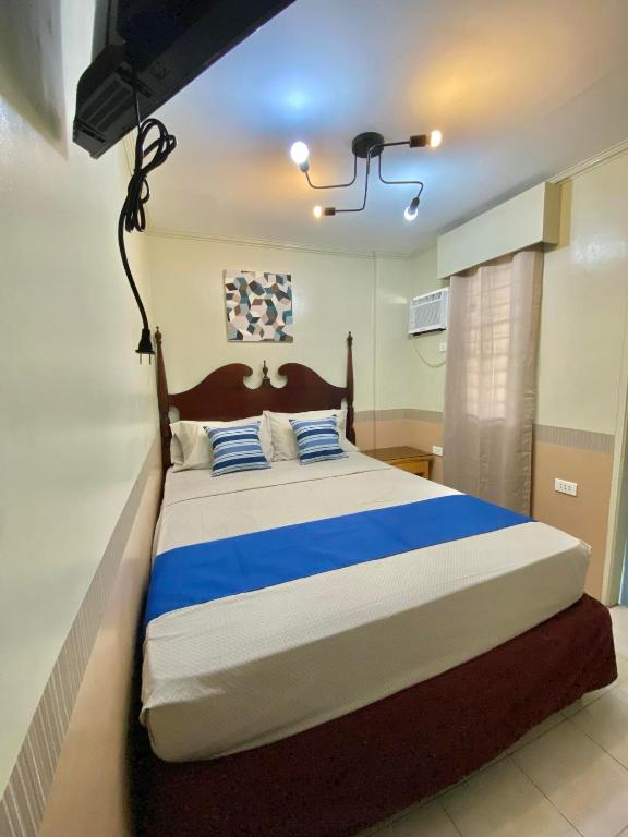 Postel nebo postele na pokoji v ubytování Jupiter Homestay