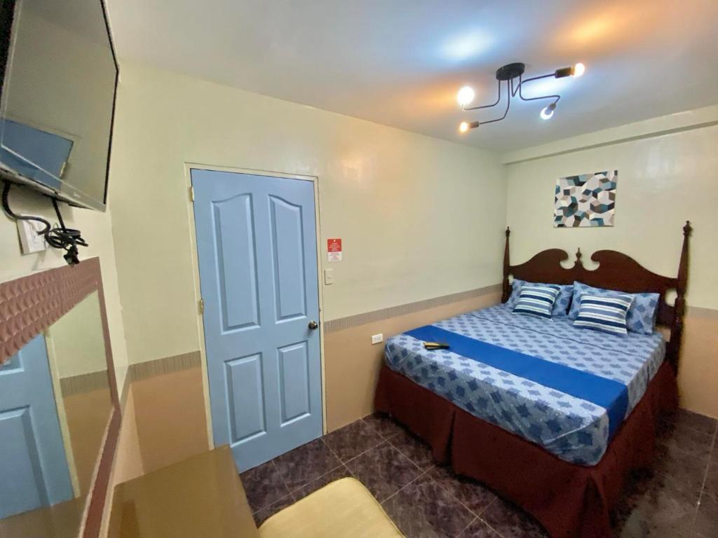 Postel nebo postele na pokoji v ubytování Jupiter Homestay