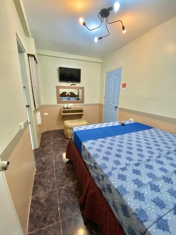 Postel nebo postele na pokoji v ubytování Jupiter Homestay