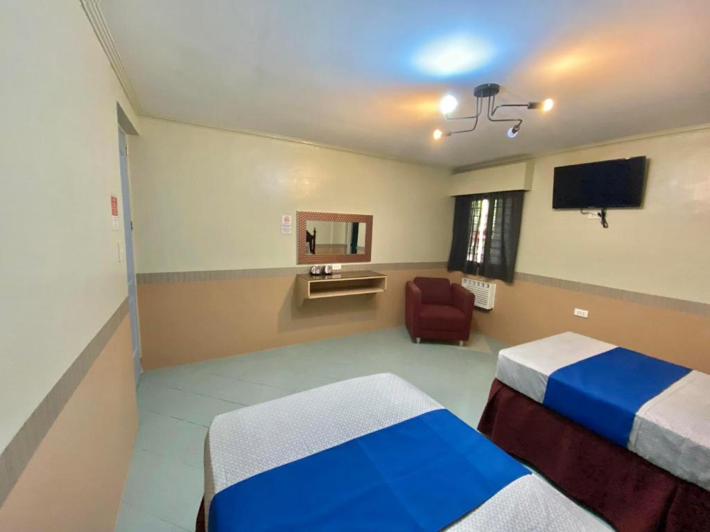 Postel nebo postele na pokoji v ubytování Jupiter Homestay