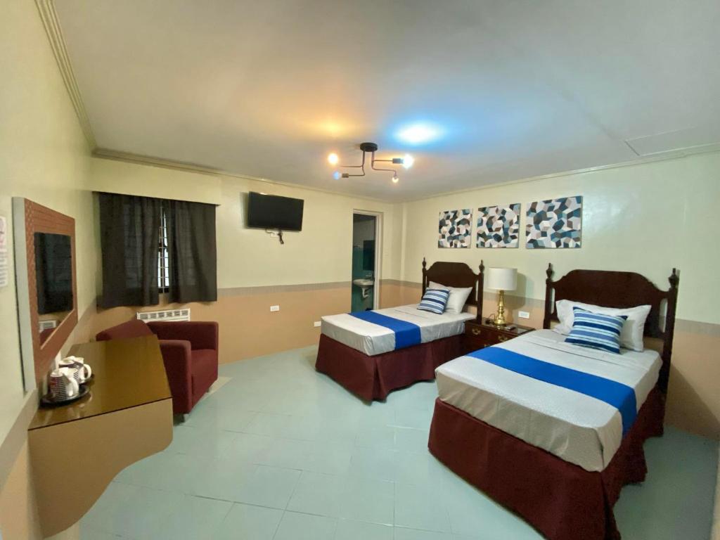 Postel nebo postele na pokoji v ubytování Jupiter Homestay