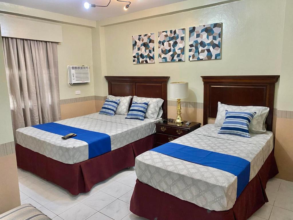 Postel nebo postele na pokoji v ubytování Jupiter Homestay