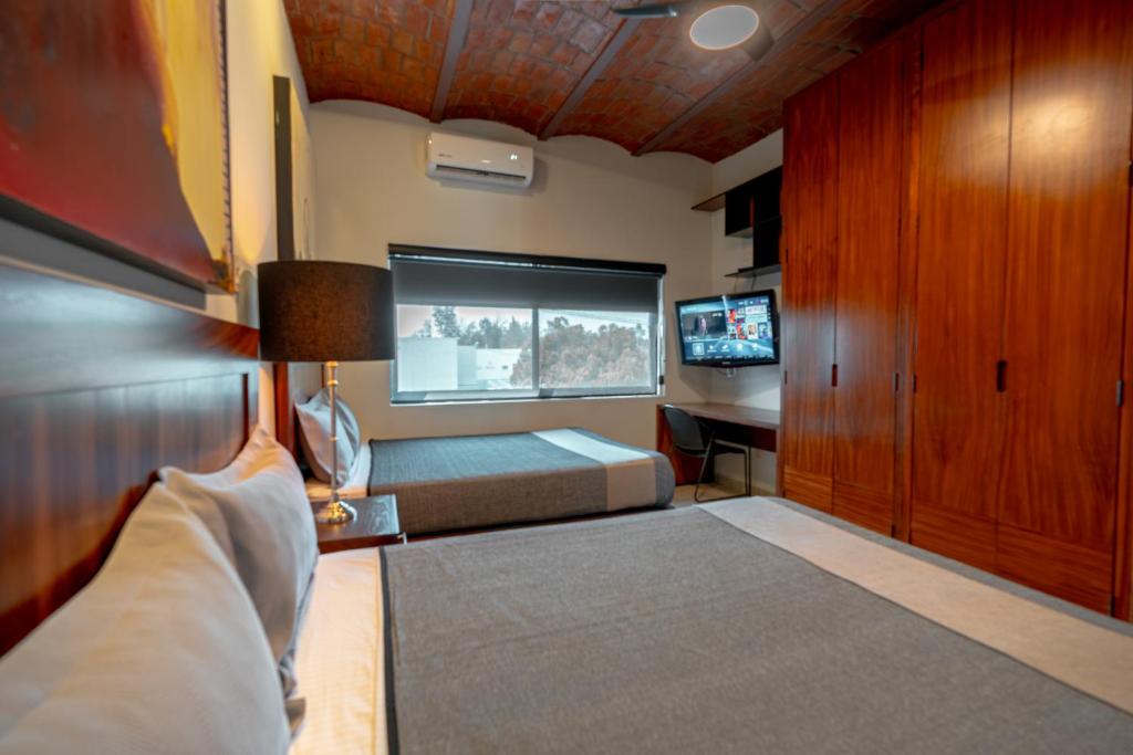 Postel nebo postele na pokoji v ubytování Hotel NG