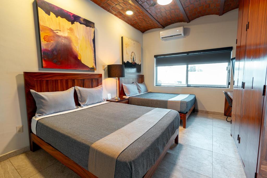 Postel nebo postele na pokoji v ubytování Hotel NG