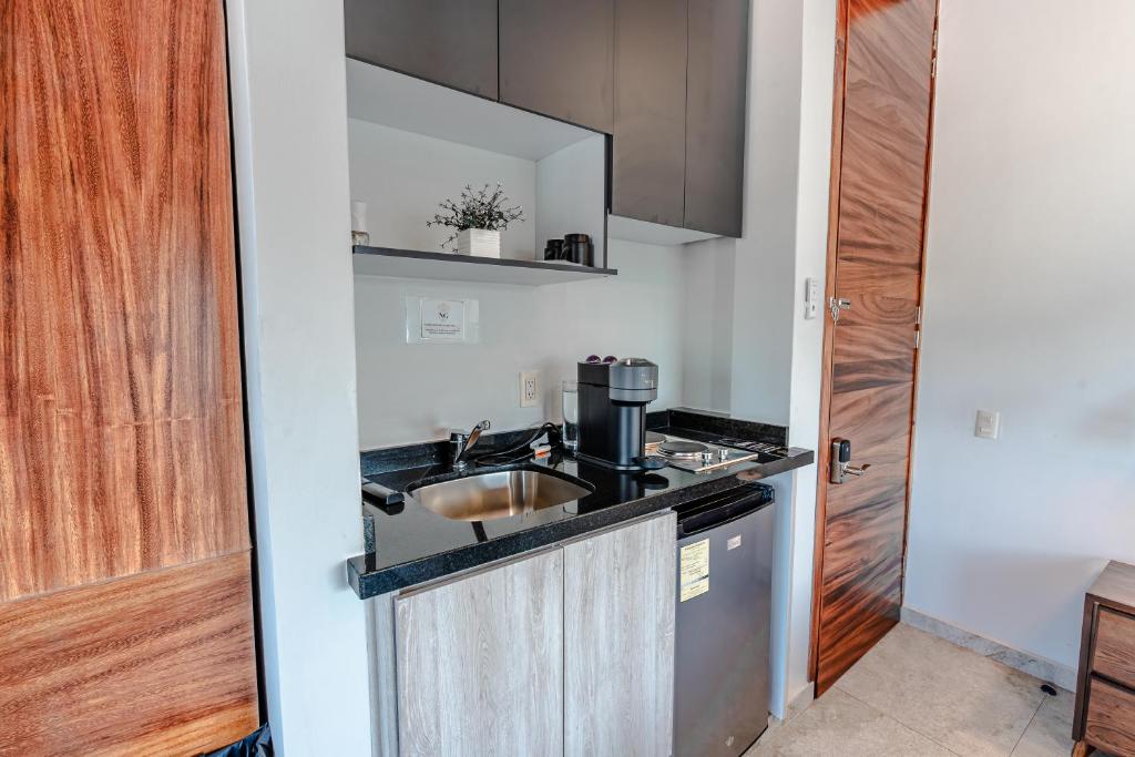 Kuchyň nebo kuchyňský kout v ubytování Hotel NG