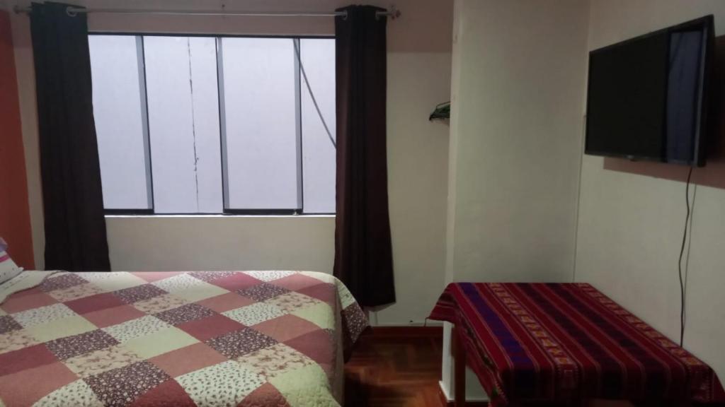 Postel nebo postele na pokoji v ubytování Kaboka Cusco Hospedaje Familiar