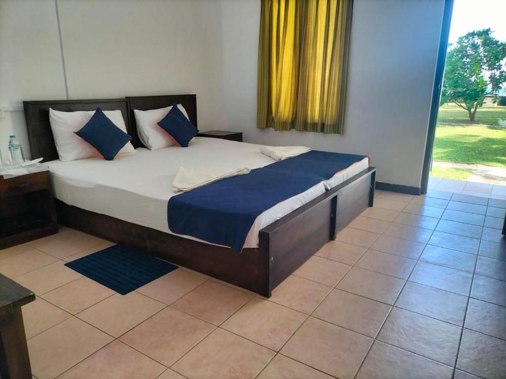 Postel nebo postele na pokoji v ubytování Hotel Coral Bay