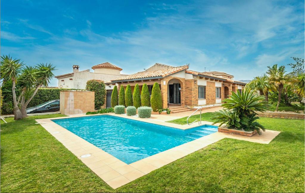 a house with a swimming pool in the yard at Cozy Home In Hospitalet De Linfant in Hospitalet de l'Infant
