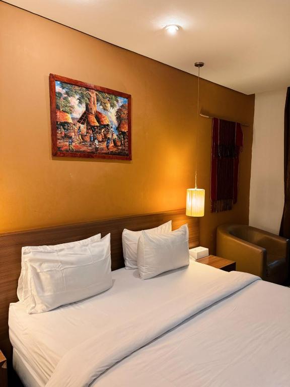 Postel nebo postele na pokoji v ubytování Hotel Ompu Herti