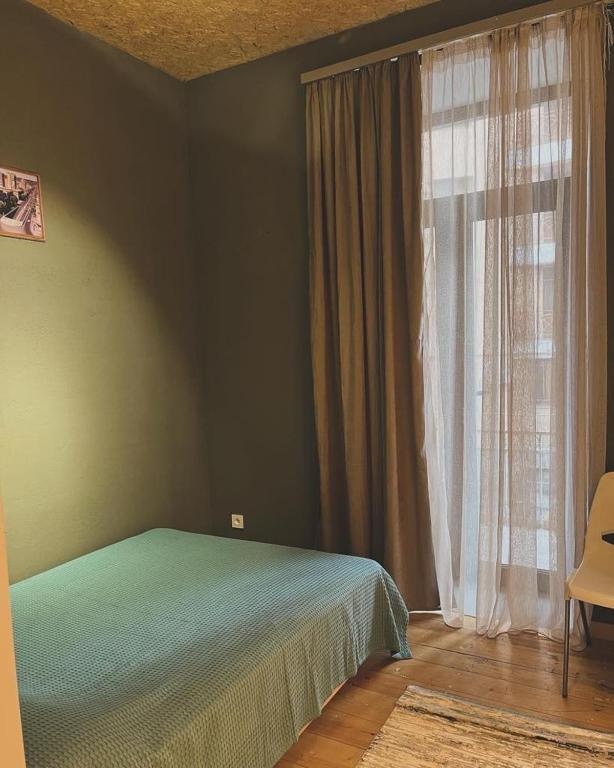 Postel nebo postele na pokoji v ubytování Blue Orange