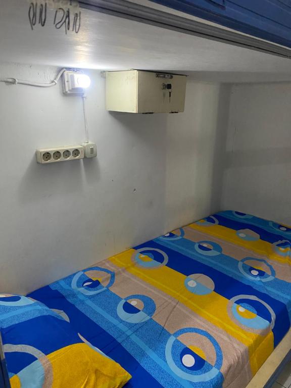 Postel nebo postele na pokoji v ubytování Cempaka hostel