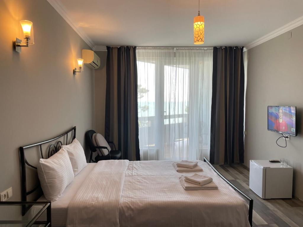 Postel nebo postele na pokoji v ubytování Argo Hotel