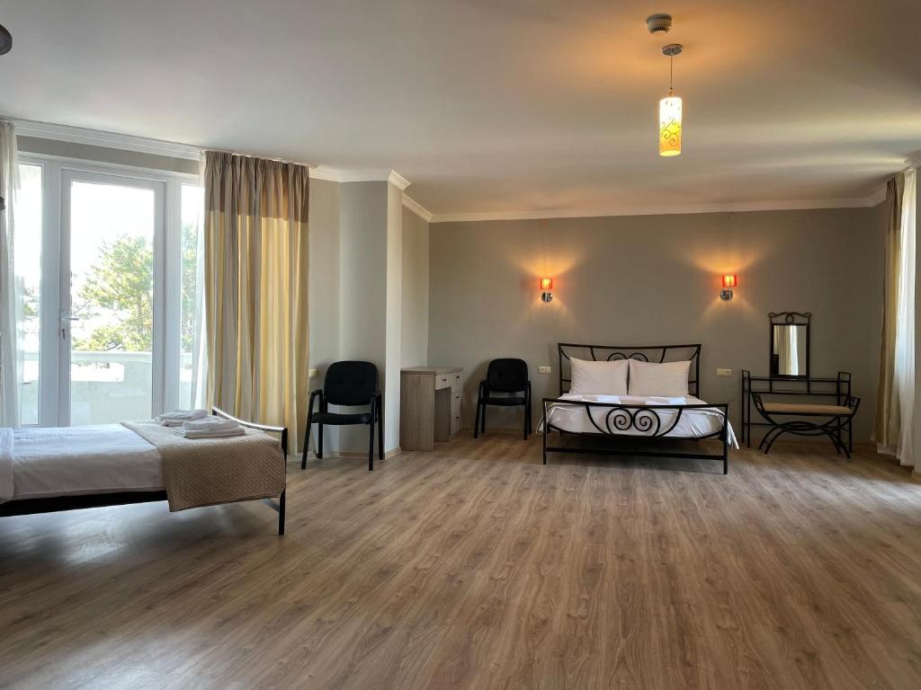 Postel nebo postele na pokoji v ubytování Argo Hotel