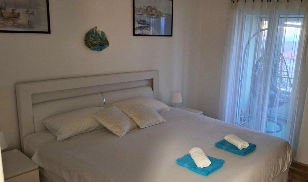 Postel nebo postele na pokoji v ubytování Apartman Lane