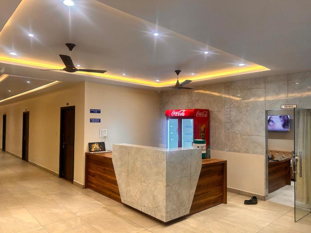a lobby with a cash counter in a building at SV Banquets And Luxury Rooms in Farrukhnagar