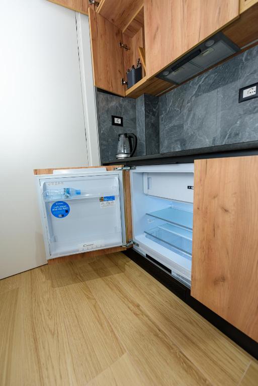 Kuchyň nebo kuchyňský kout v ubytování Kevin's ApartHotel