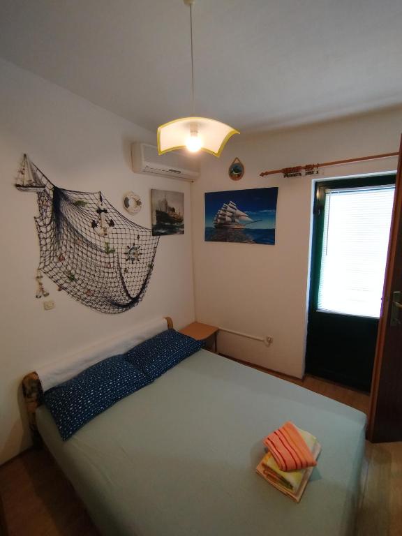 Postel nebo postele na pokoji v ubytování Rooms Tia