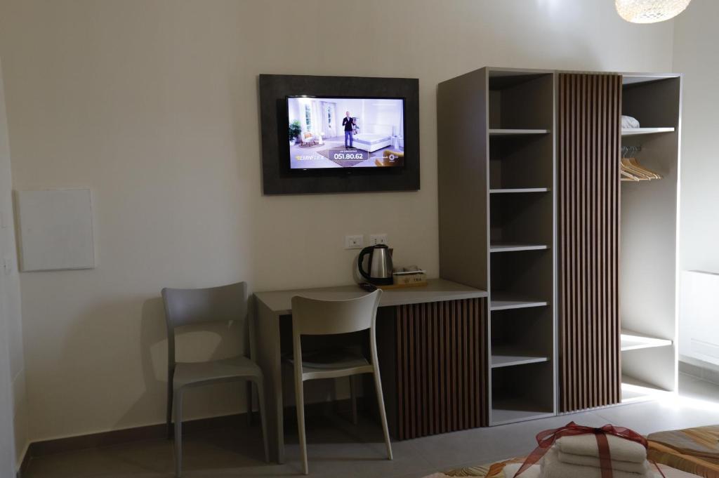TV a/nebo společenská místnost v ubytování B&B Il Giardino Dei Templi