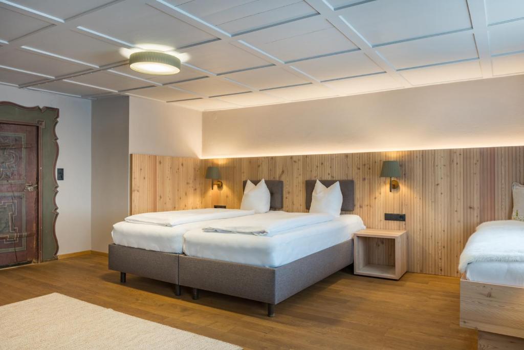 Postel nebo postele na pokoji v ubytování Hotel Sonne
