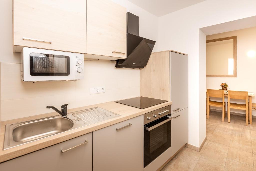 Kuchyň nebo kuchyňský kout v ubytování Mentenwirt Pension&Appartements