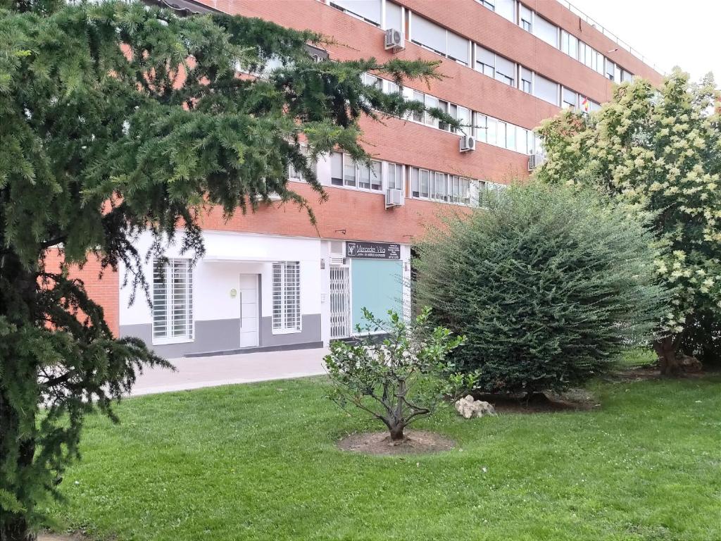 a building with a green yard in front of a building at Casa Koala VT14462 in Pinto