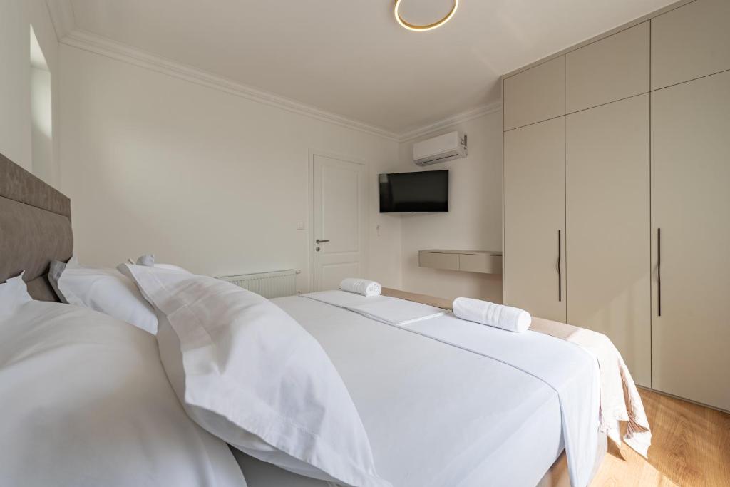 Postel nebo postele na pokoji v ubytování Rooms & Apartments Niko