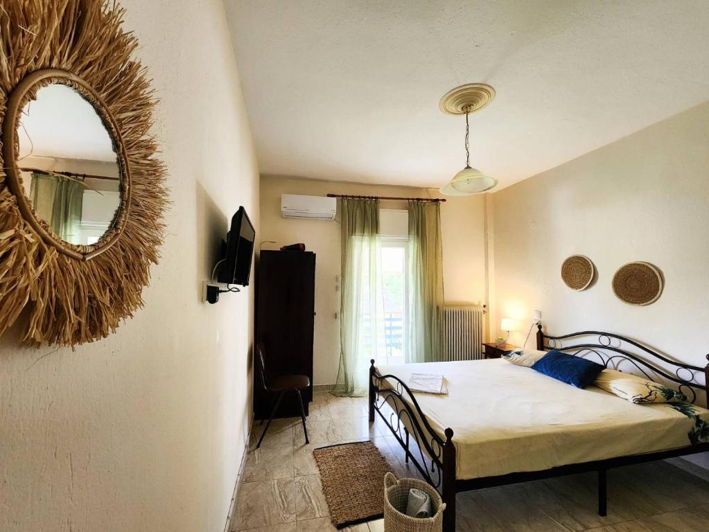 Postel nebo postele na pokoji v ubytování Aktaion Hotel