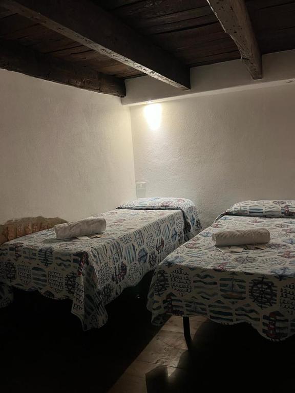 Postel nebo postele na pokoji v ubytování Apartment Camere Cinque Terre Andrea