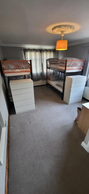 a room with two bunk beds and a table at stay wise in Dublin