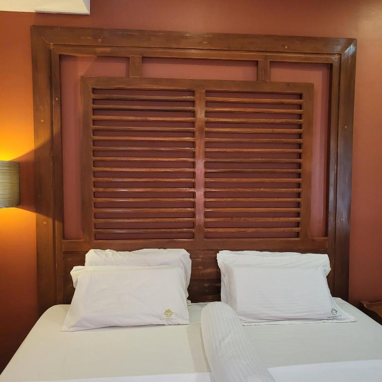 Postel nebo postele na pokoji v ubytování Green Monkey Resort Boracay