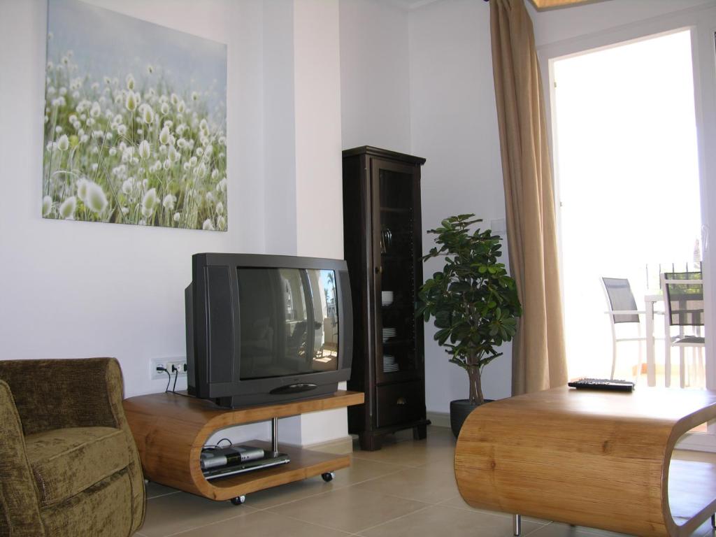 TV a/nebo společenská místnost v ubytování Hacienda Golf Resort - 1508