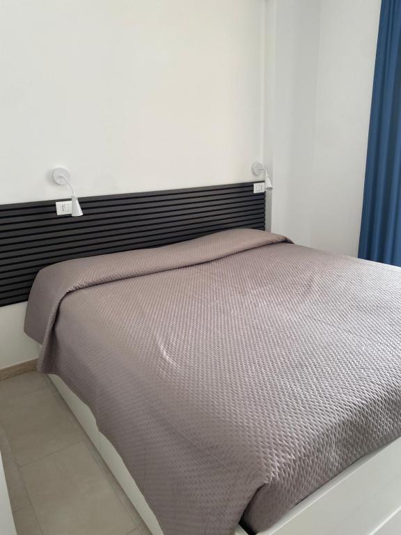 Postel nebo postele na pokoji v ubytování Manfredi Sea Room