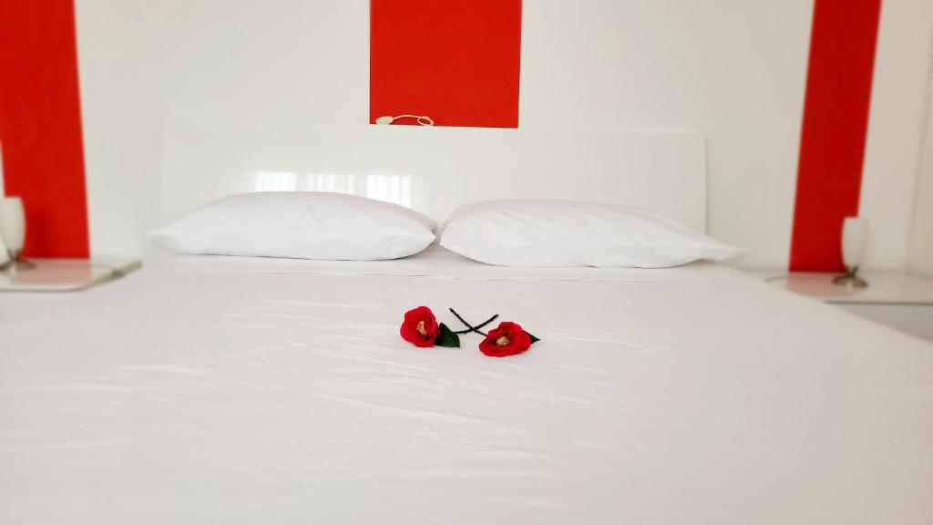 Voodi või voodid majutusasutuse Alghe Rosse Relax toas
