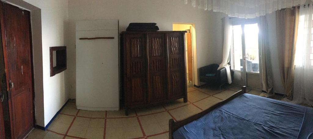 Postel nebo postele na pokoji v ubytování Farida Lodge