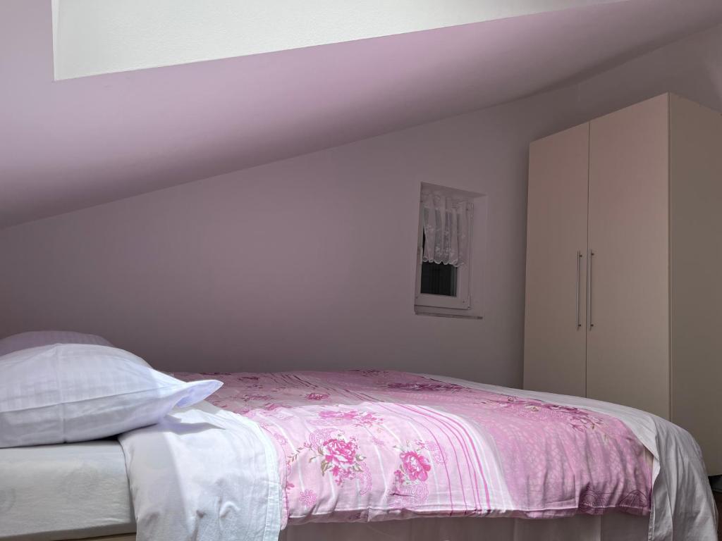 Voodi või voodid majutusasutuse Rooms & Apartment Mama Mia toas