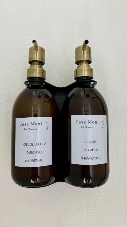 two bottles of soap sitting next to each other at Casa Moni con Vistas al Mar in Playa de Santiago